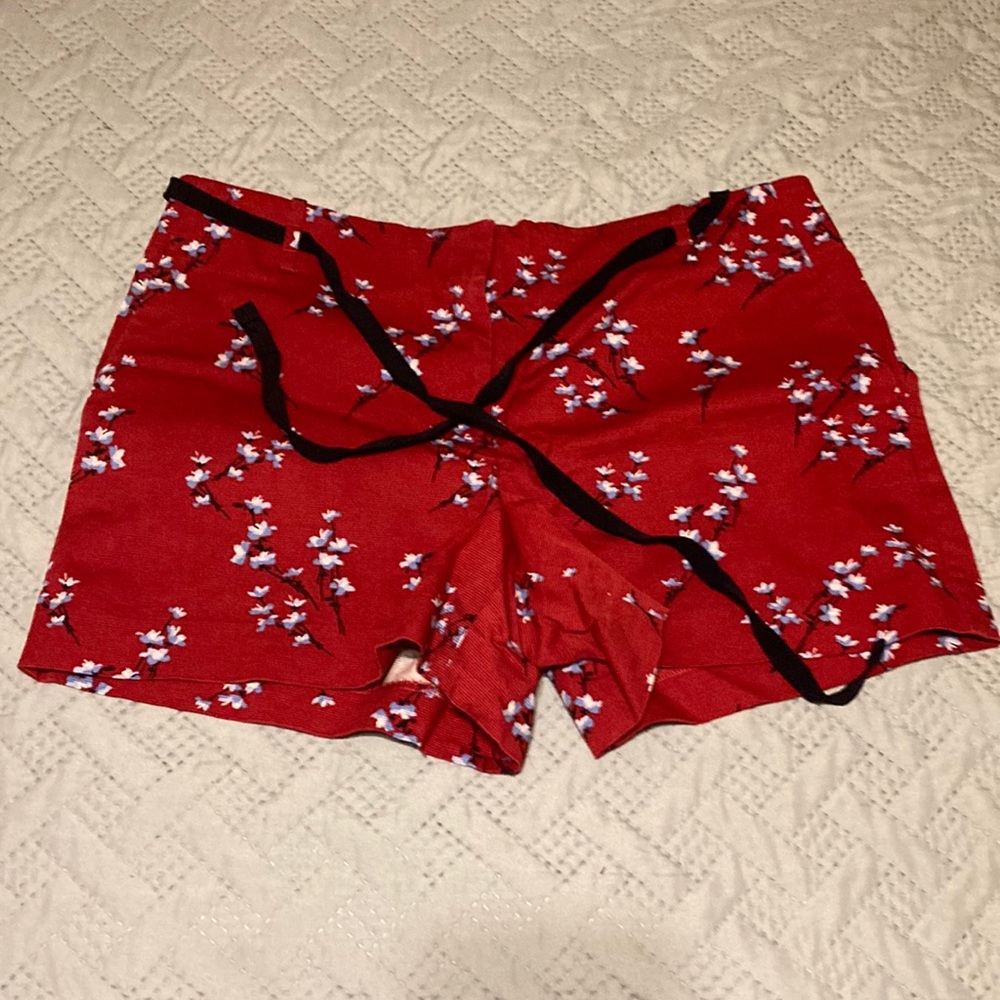 Red tie-waist floral shorts